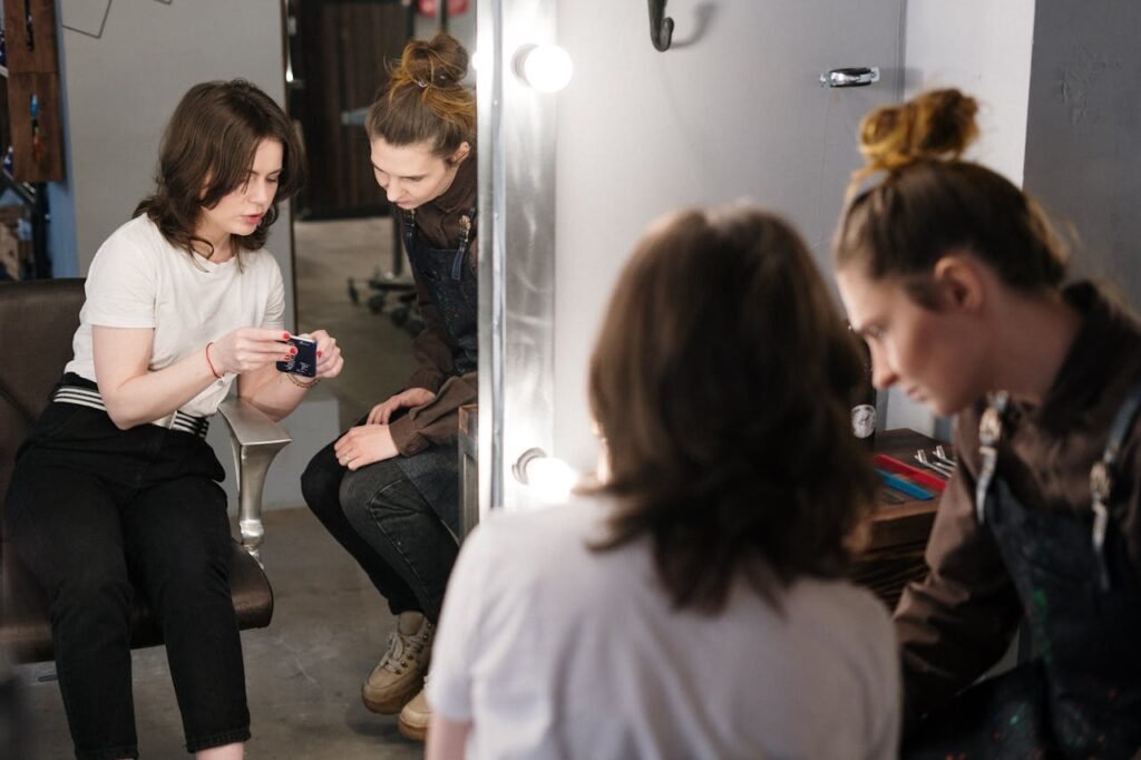 The Art of Drawing Readers In: Your attractive post title goes here Two women engaged in a hair consultation at a salon, reflecting professionalism and style.